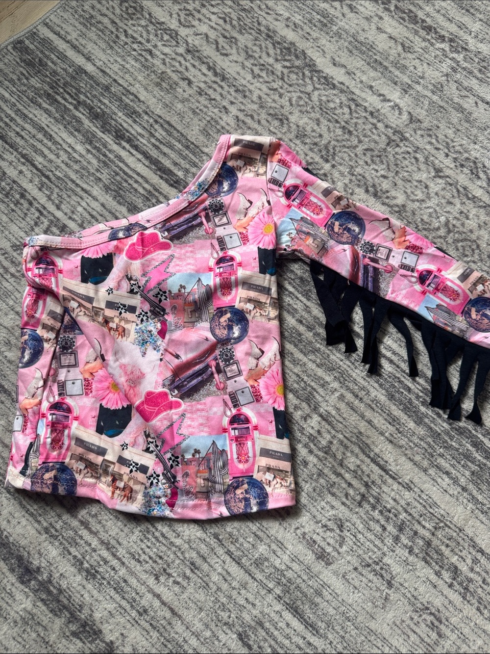 Girls Pink Graphic One-Shoulder Top with Black Fringe Sleeve